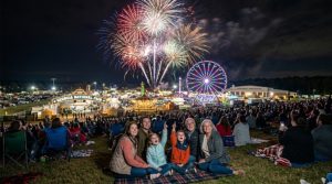Families watching nightly fireworks light up the sky above the Georgia National Fairgrounds in Perry during the Georgia National Fair 2026