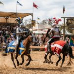 Costumed performers jousting on horseback at the Texas Renaissance Festival 2026