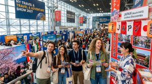 Excited travelers exploring destination booths at the New York Travel and Adventure Show 2027 in New York City